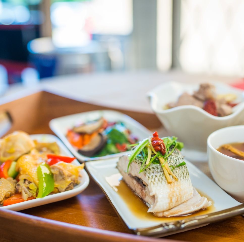 Healthy7 recovery meal with steamed fish, vegetables, soup and side dishes