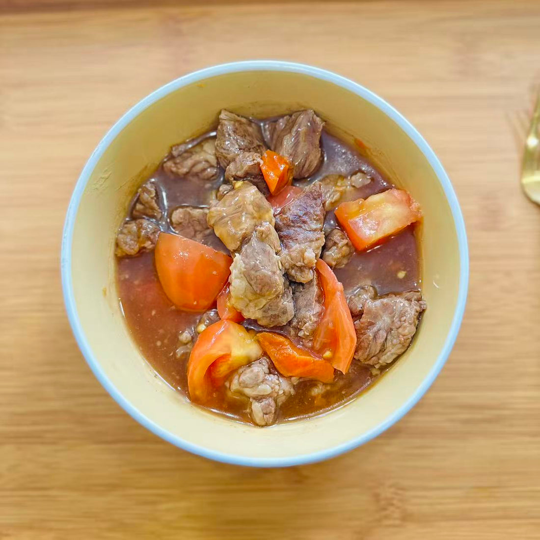 Tomato &amp; Chu Hou Braised Beef Brisket in a 16 oz Family Meals container.