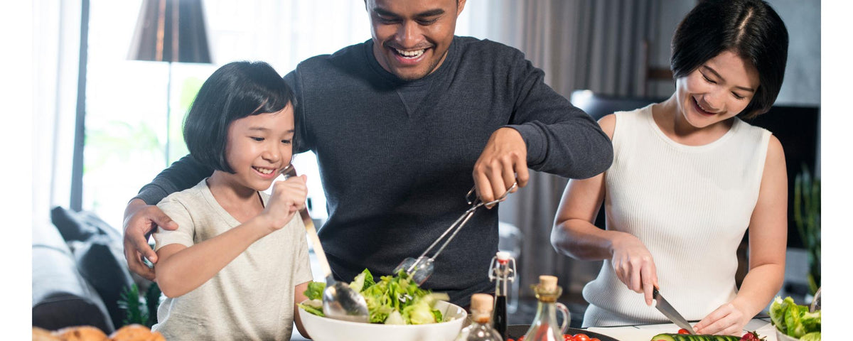 Family preparing fresh Asian-inspired meals together at home