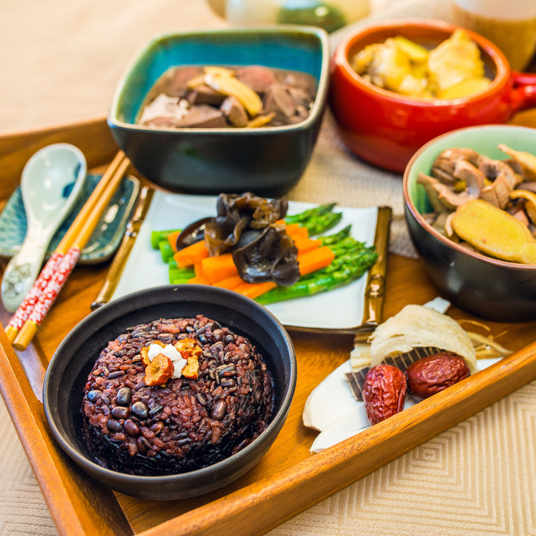 Assorted Chinese postpartum meals with multigrain rice, vegetables, soup and nourishing dishes
