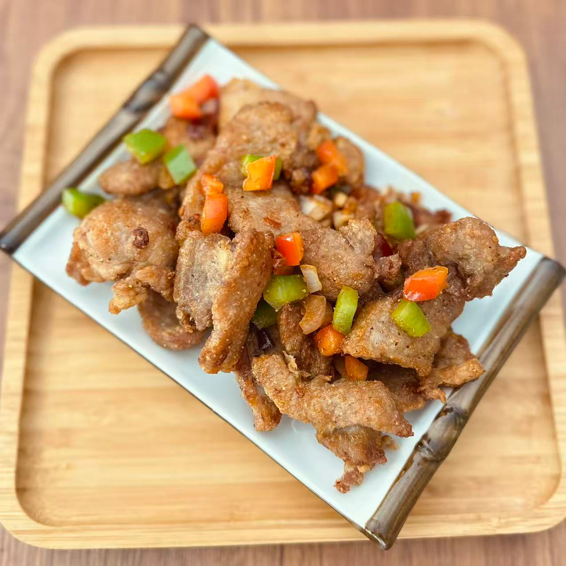 Salt &amp; Pepper Pork Chop in a 16 oz Family Meals container.