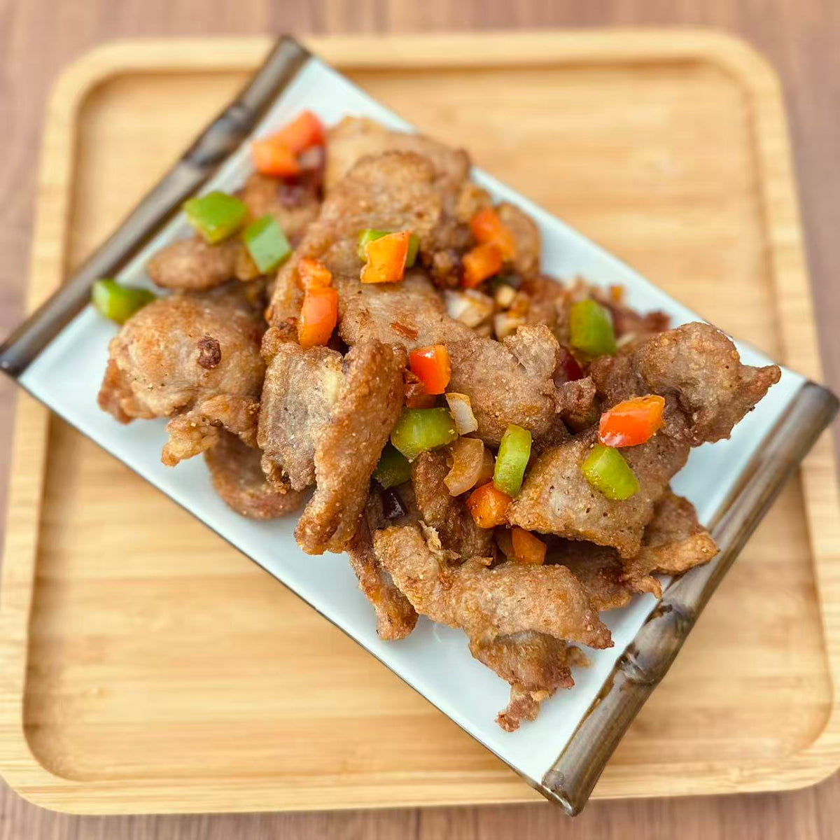 Salt &amp; Pepper Pork Chop in a 16 oz Family Meals container.